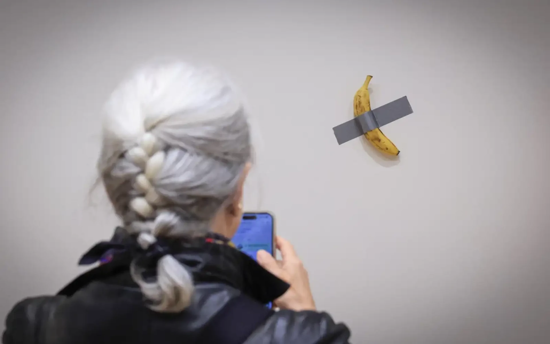 Comedian, the controversial artwork by Maurizio Cattelan, consists of a fresh banana taped to a wall. Courtesy of FMT.com